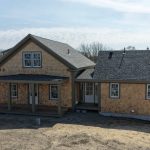 Aerial view of Chatham property with white cedar siding
