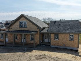Aerial view of Chatham property with white cedar siding