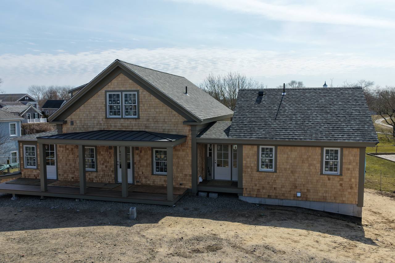 Aerial view of Chatham property with white cedar siding